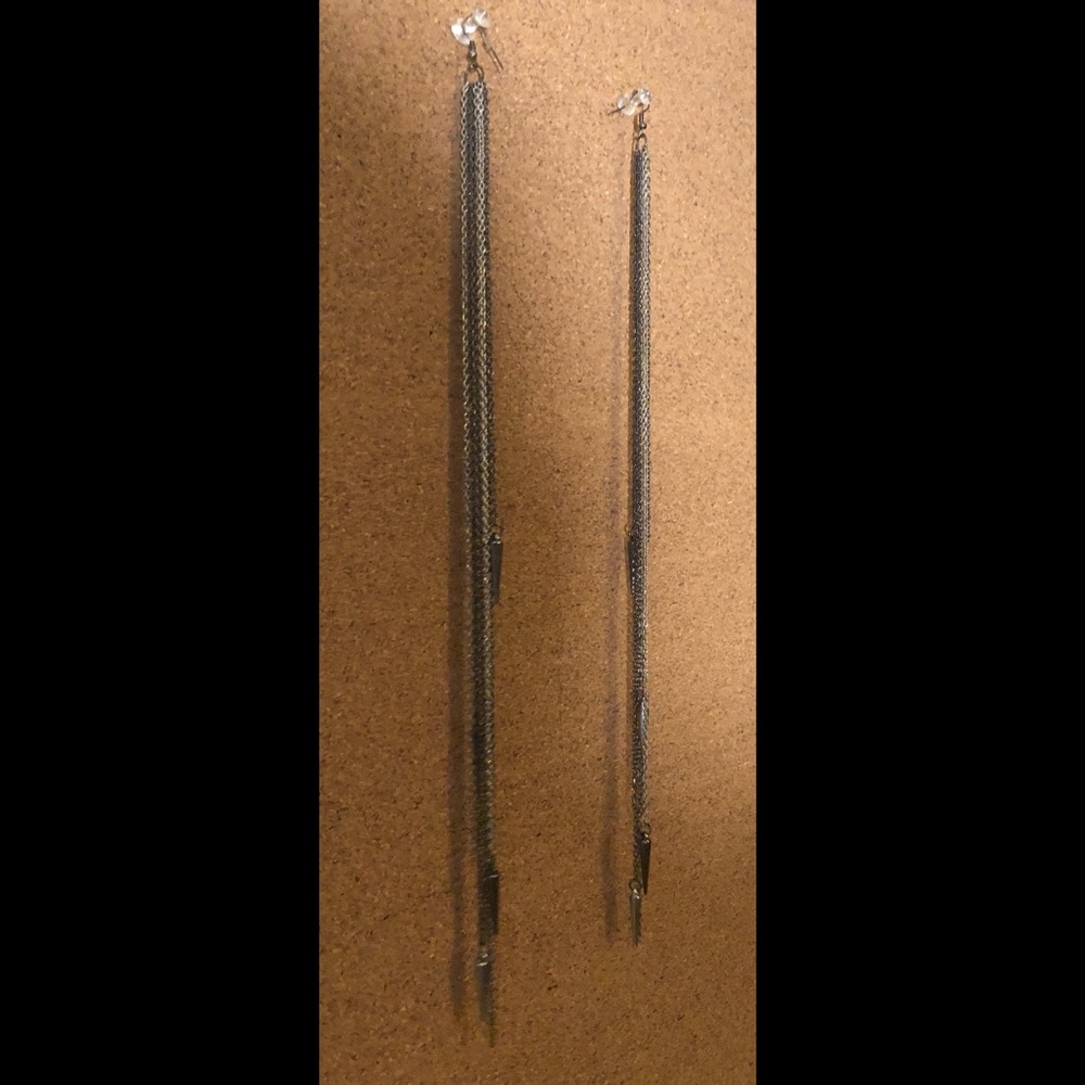 Long silver earrings with spikes